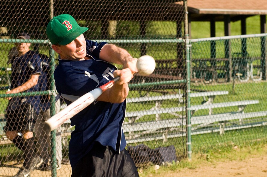 HANSCOM AIR FORCE BASE, Mass. - James Astle, on the MIT Lincoln Laboratory team, takes a swing during an intramural softball game on June 14. Base intramural softball began last week and many base organizations and personnel are taking part. (U.S. Air Force photo by Mark Herlihy)