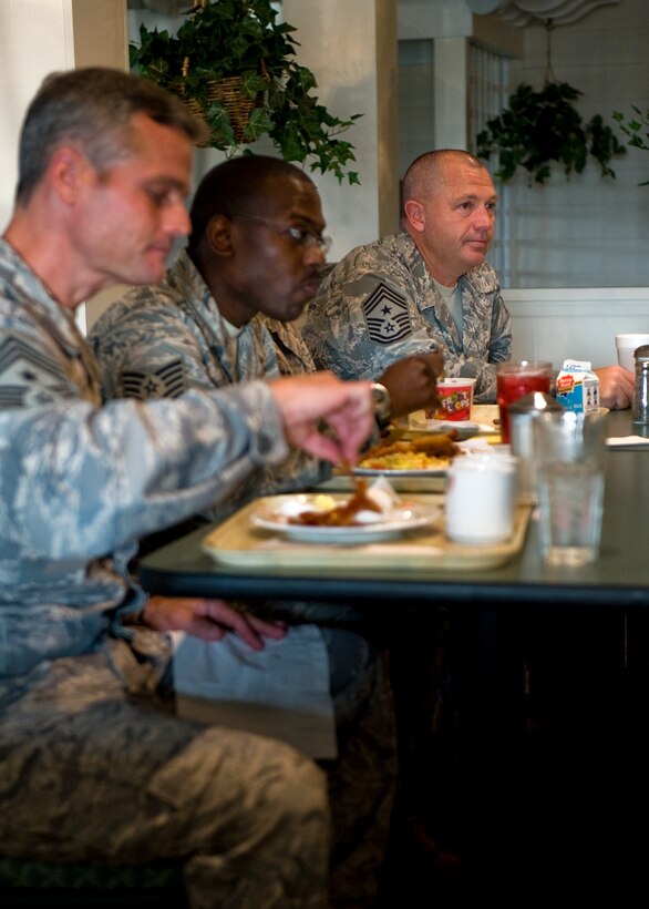LANGLEY AIR FORCE BASE, Va. -- Chief Master Sgt. Scott Dearduff, 9th Air Force command chief, listens to a question posed by an Airman during breakfast June 17.  Dearduff took time to visit Langley and talk with its Airmen.  (U.S. Air Force photo/Senior Airman Zachary Wolf)