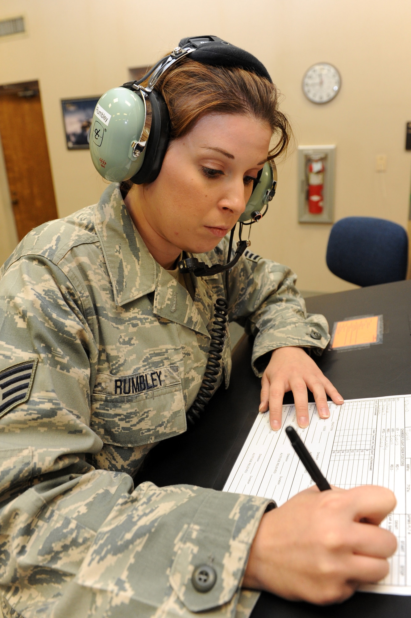 Staff Sgt. Kathleen Rumbley, 19th Medical Group NCO- in-charge of admission for aerospace and operational physiology, annotates all events that happen June 11 during a chamber flight. All events are monitored and recorded during chamber flights to make sure that flights are running smoothly and safely. (U.S. Air Force photo by Senior Airman Ethan Morgan)
