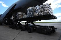 MINOT AIR FORCE BASE, N.D. -- Airman 1st Class Zachary Miller 5th Logistics Readiness Squadron refueling equipment operator, loads supplies onto a C-5 Galaxy from Wright-Patterson AFB, Ohio, here June 8. The C-5 was scheduled to drop off supplies in support of the 23rd Bomb Squadron’s deployment to Andersen AFB, Guam. It is providing essential parts needed to provide continuous bomber presence in the Pacific Region. (Air Force photo by Airman 1st Class Aaron-Forrest Wainwright)