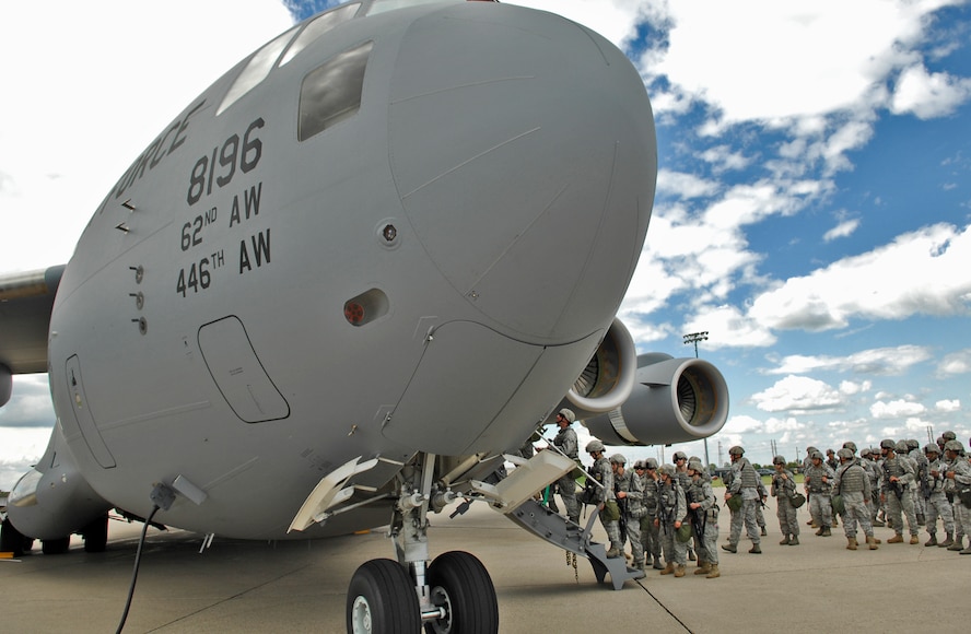 MINOT AIR FORCE BASE, N.D. – Airmen from the 5th Security Forces Squadron line up outside a C-17 Globemaster III from McChord AFB, Wash., for weapons familiarization training here June 8.   The C-17 provides the Airmen with the opportunity enhance their skills on unfamiliar airframes. (U.S. Air Force photo by Staff Sgt. Miguel Lara III)