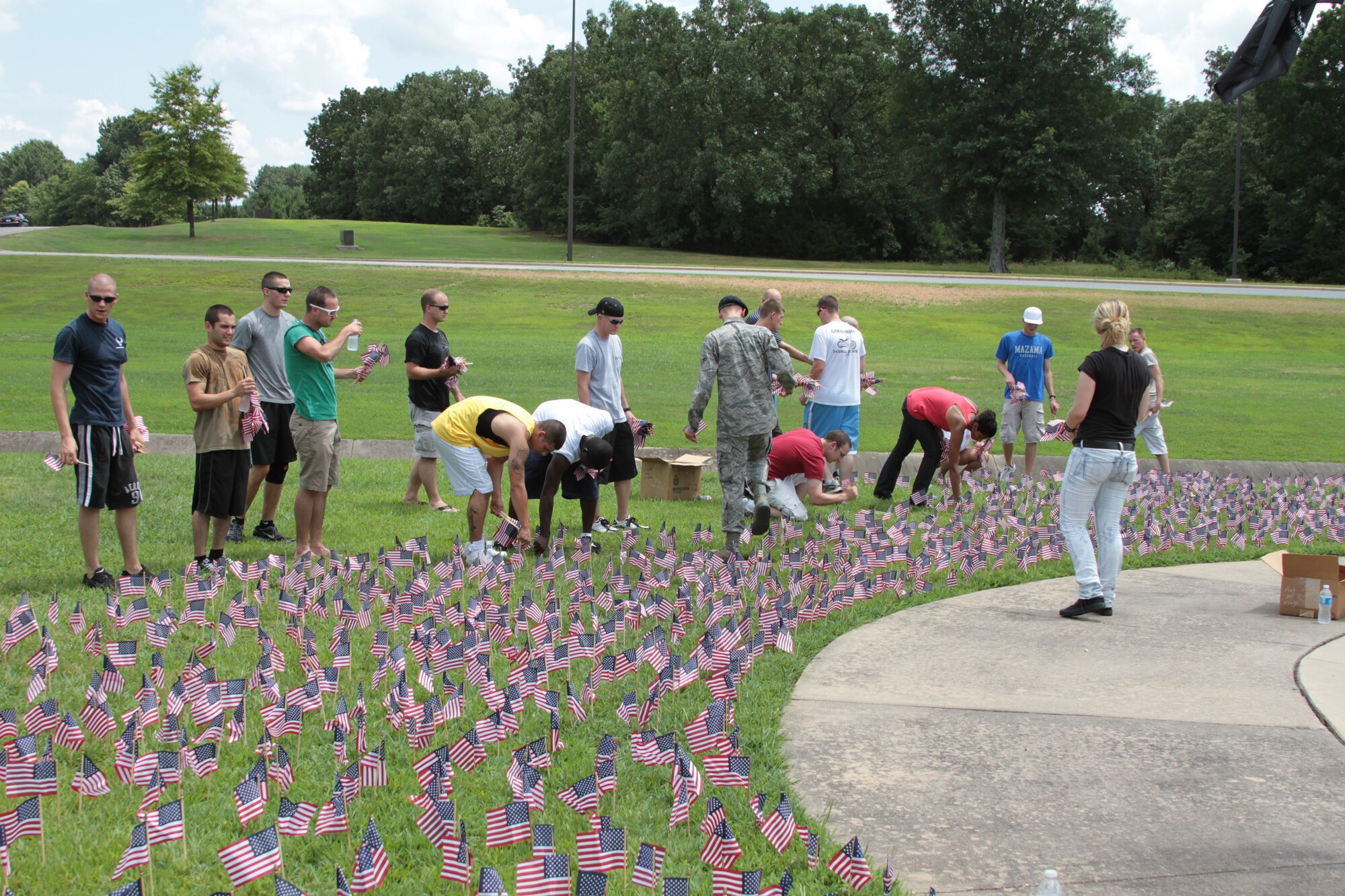 Airmen from the First Term Airmen Center set up 1,400 American flags June 13 at Heritage Park. A National Flag Day prayer observance was held June 14 at the flag display. (U.S. Army photo by Spc. Jared Sollars)