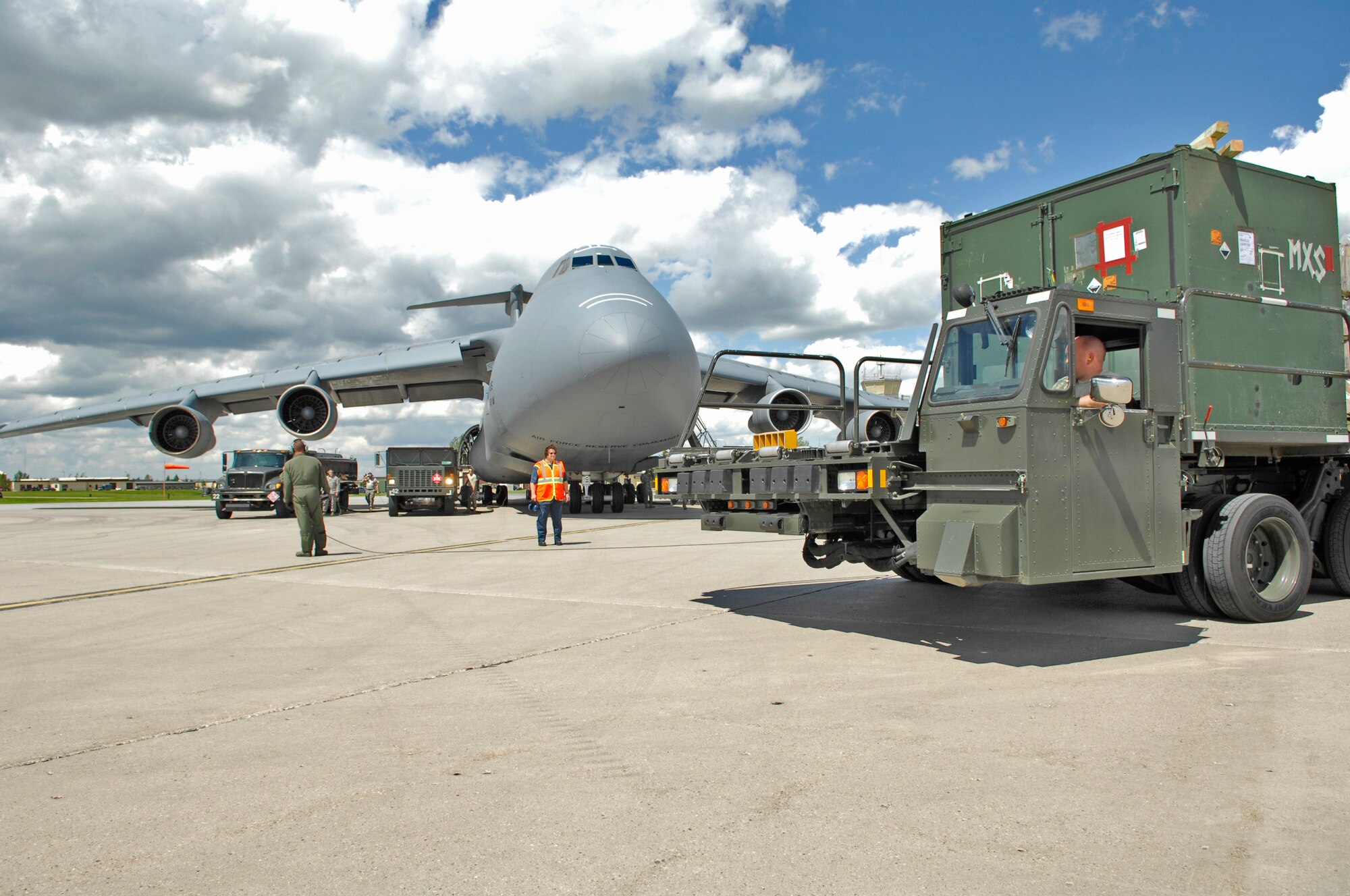 MINOT AIR FORCE BASE, N.D. – Airmen from the 5th Bomb Wing refuel and load supplies onto a C-5 Galaxy from Wright-Patterson AFB, Ohio, here June 8.  The C-5 was scheduled to drop off supplies at Andersen AFB, Guam, in support of the 23rd Bomb Squadron’s deployment there. The C-5 is providing essential parts needed to provide continuous bomber presence in the Pacific Region. (U.S. Air Force photo by Staff Sgt. Miguel Lara III)