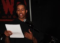 MINOT AIR FORCE BASE, N.D. -- Airman 1st Class Dominique Johnson, 5th Force Support Squadron personnelist, who goes by the stage name “SOUL” (Spirit of unconditional love), reads his poetry at J.R. Rockers Open Mic Night here June 11. Open Mic Night was presented by the I.M.T (Improving Morale Together) Committee and featured live performances of poetry and various genres of music. (U.S. Air Force photo by Staff Sgt. Sharida Jackson)