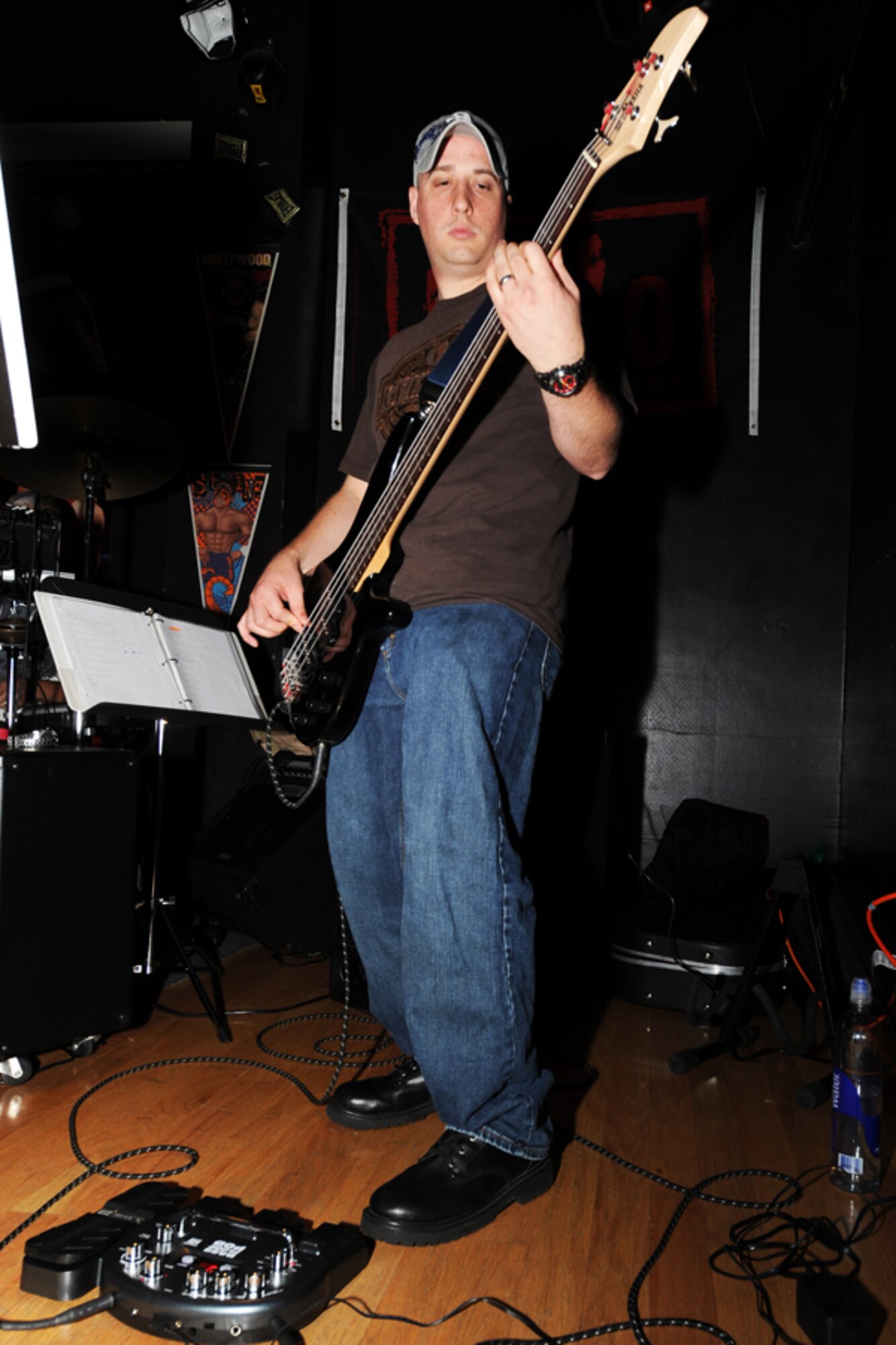 MINOT AIR FORCE BASE, N.D. -- Staff Sgt. Steven Bailey, 5th Maintenance Squadron hydraulics craftsman, plays the bass during a performance at J.R. Rockers Open Mic Night here June 11. Open Mic Night was presented by the I.M.T. (Improving Morale Together) Committee and featured live performances of poetry and various genres of music. (U.S. Air Force photo by Staff Sgt. Sharida Jackson)