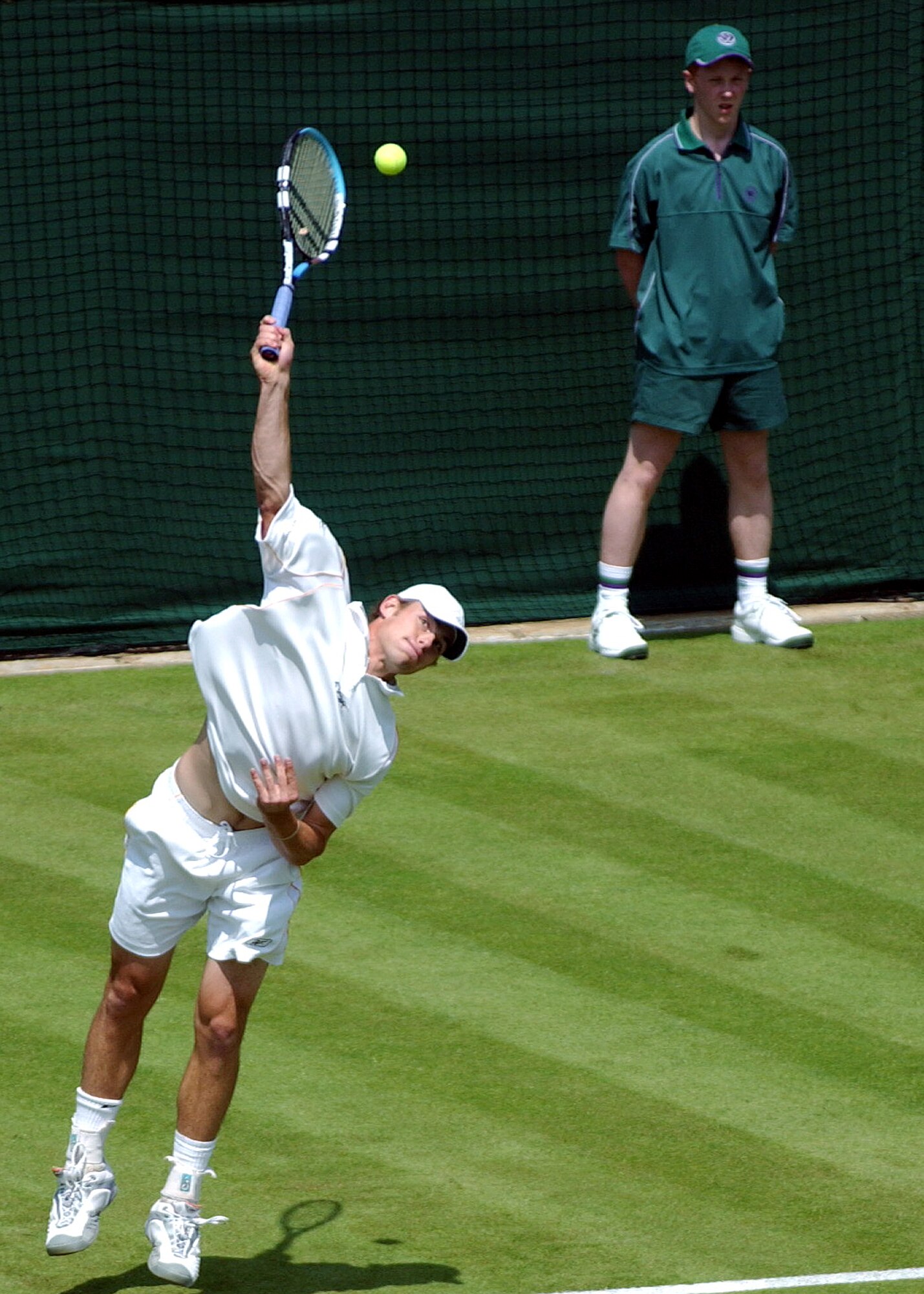 Andy Roddick of the USA hits a serve during a first round match at the 2003
Wimbledon Championships held in London, England.  (Photo courtesy of Tony Tolley)
