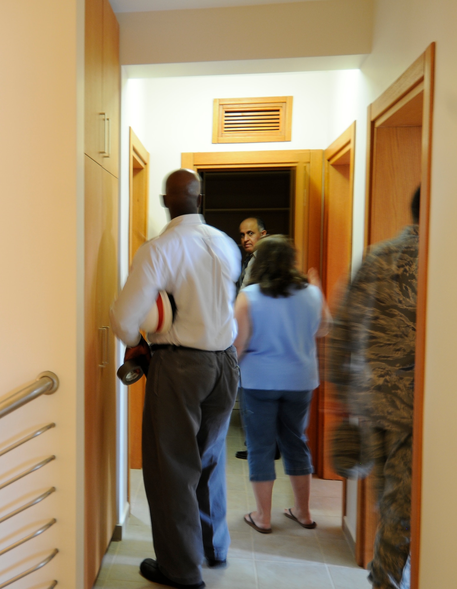 After the ribbon cutting, attendees walk through to get a look at the newly built Eagle Housing phase three townhomes Tuesday, June 15, 2010 at Incirlik Air Base, Turkey. About 44 new townhomes were added to the community.  Replacing facilities built in 1961, Incirlik is in the final stages of phase three of the Eagle Housing project which will improve the quality of life for its members. With help from the USACE, Incirlik will soon have 650 new housing units to include renovated homes in Phantom and Falcon housing areas (U.S. Air Force photo/Senior Airman Alexandre Montes)
