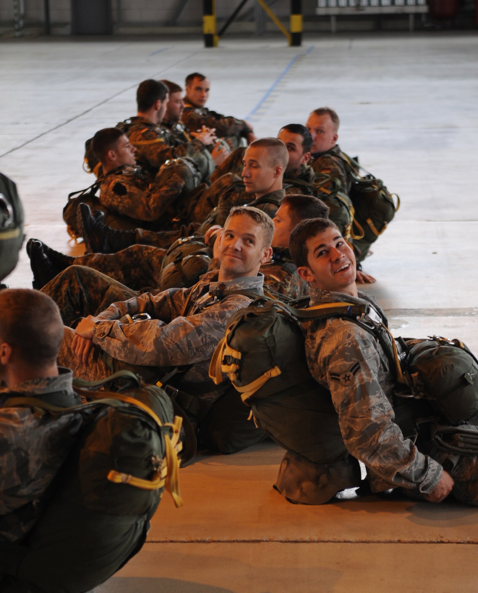 Airborne troops wait to depart for a static line jump from a C-130J as part of the NATO jump week, Ramstein Air Base, Germany, June 15, 2010. Five NATO countries participated in the annual event to support one of United States Air Forces in Europe's top priorities; building partnerships. (U.S. Air Force photo by Airman 1st Class Caleb Pierce)