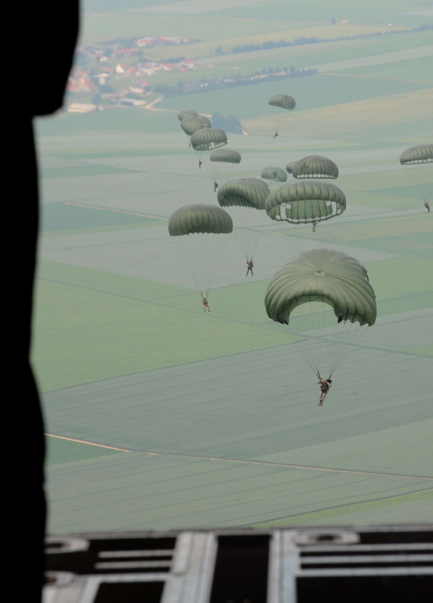 Airborne troops jump from a C-130J as part of the NATO jump week, Alzey, Germany, June 15, 2010. Five NATO countries participated in the annual event to support one of United States Air Forces in Europe's top priorities; building partnerships. (U.S. Air Force photo by Airman 1st Class Caleb Pierce)