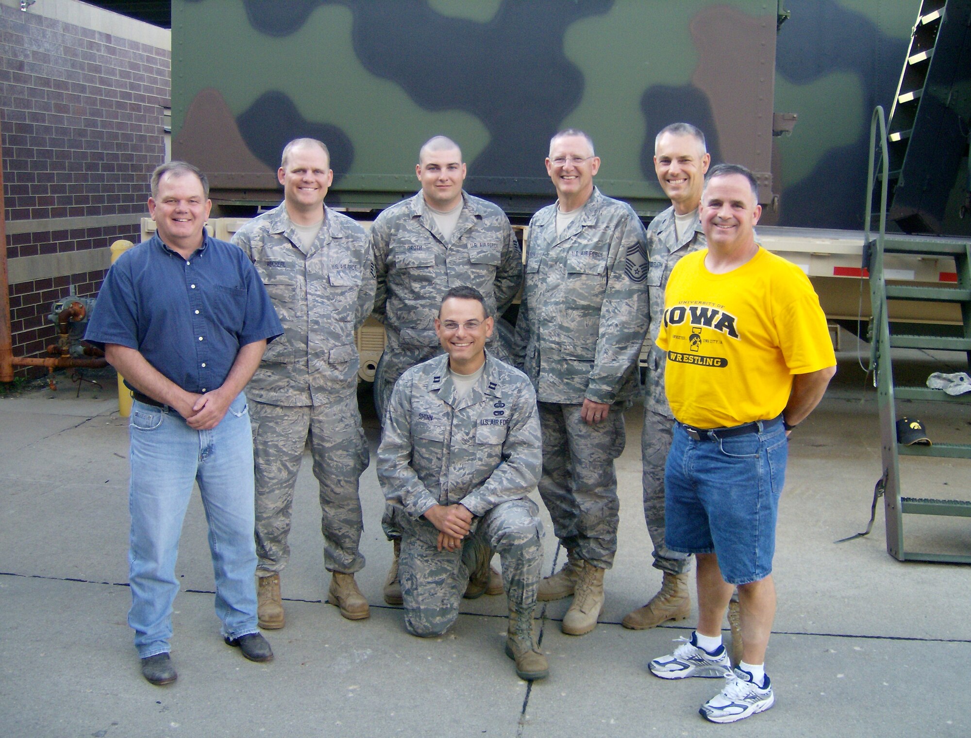 From Left, Standing: Col. Brian Miller, SSgt. Zachary Ascherl, SSgt. Ben Groth, CMSgt. Don Kuehl, Lt. Col. Neil Stockfleth and Lt. Col. Joe Ascherl. Kneeling: Capt. Peter Shinn. Col. Miller and Lt. Col. Ascherl hand-delivered care packages to the 734th Agri-Business Development Team (ADT). The five uniformed service members seen here are 185 ARW members who are currently assigned to the ADT, a Joint Iowa Army and Iowa Air National Guard deployment to Afghanistan.