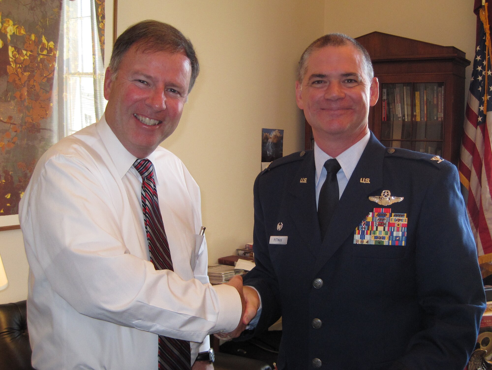 Col. Jay Pittman thanks Rep. Doug Lamborn for his time after the colonel provided an update on 302nd Airlift Wing current deployments and missions during a June 10 office call in the congressman’s Washington D.C. office. Together with Representative Lamborn, who represents Colorado’s 5th District, Colonel Pittman also met with both Colorado senators and another of the state’s congressmen. The visit was part of the Air Force Reserve Integration Orientation Course that gave leadership from the 302nd AW, an Air Force Reserve organization, the opportunity to share updates on the wing's recent and upcoming deployments as well as significant events. Colonel Pittman, the 302nd AW’s commander, was also joined by the wing’s command chief, Chief Master Sgt. Joesph Westerlund. (U.S. Air Force photo/Ann Skarban)
