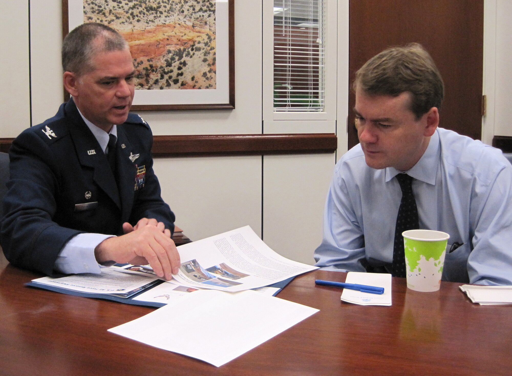 Col. Jay Pittman provides an update on 302nd Airlift Wing current deployments and missions June 10 to Colorado Senator Michael Bennet during an office call in the senator’s Washington D.C. office. Together with Senator Bennet, Colorado’s junior senator, Colonel Pittman also met with Sen. Mark Udall and two of the state’s congressmen. The visit with Senator Bennet was part of the Air Force Reserve Integration Orientation Course that gave leadership from the 302nd AW, an Air Force Reserve organization, the opportunity to share updates on the wing's recent and upcoming deployments as well as significant events. Colonel Pittman, the 302nd AW’s commander, was also joined by the wing’s command chief, Chief Master Sgt. Joesph Westerlund. (U.S. Air Force photo/Ann Skarban)