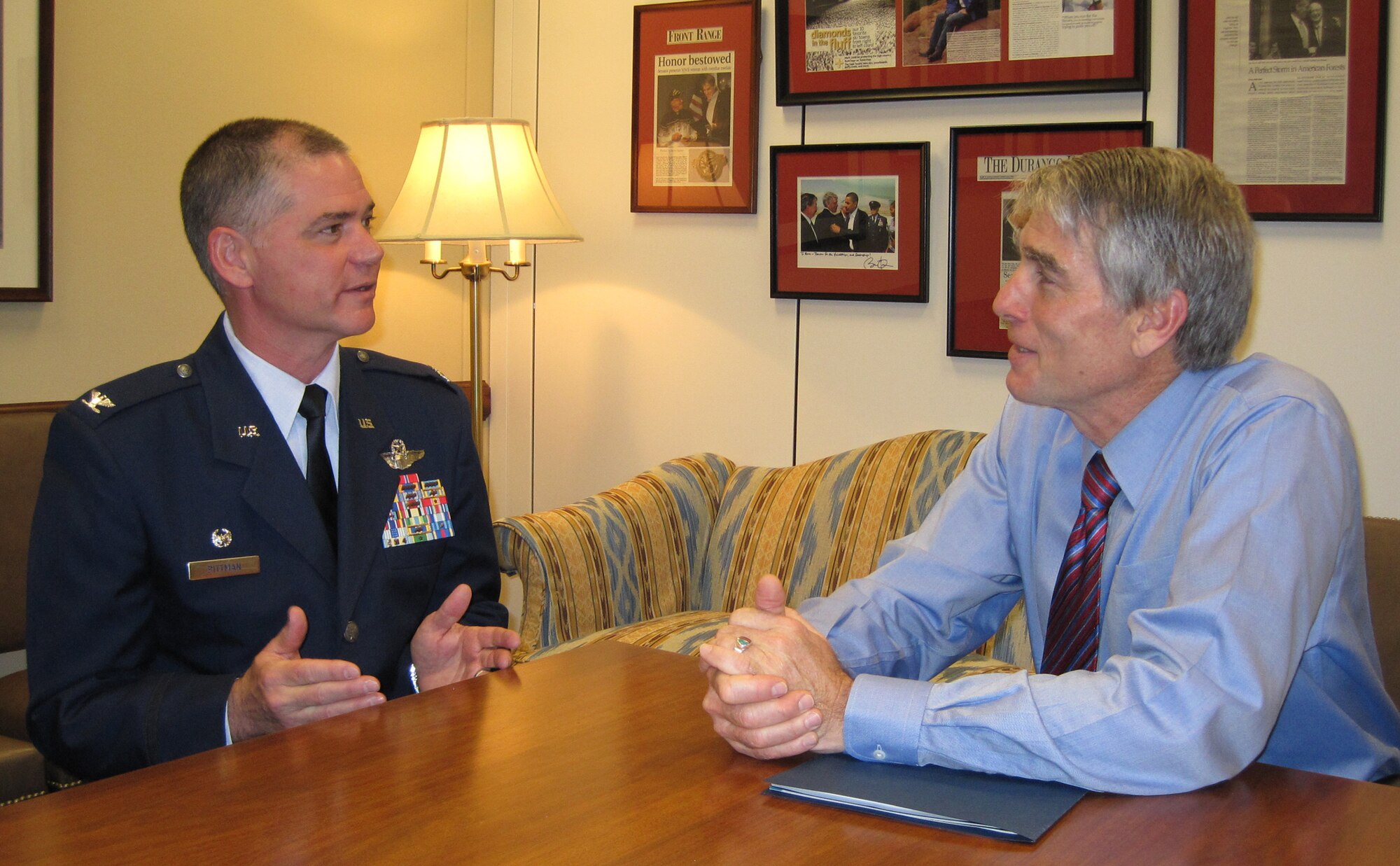 Col. Jay Pittman provides an update on 302nd Airlift Wing current deployments and missions June 9 to Colorado Senator Mark Udall during an office call in the senator’s Washington D.C. office. Together with Senator Udall, Colorado’s senior senator, Colonel Pittman also met with Sen. Michael Bennet and two of the state’s congressmen. The visit with Senator Udall was part of the Air Force Reserve Integration Orientation Course that gave leadership from the 302nd AW, an Air Force Reserve organization, the opportunity to share updates on the wing's recent and upcoming deployments as well as significant events. Colonel Pittman, the 302nd AW’s commander, was also joined by the wing’s command chief, Chief Master Sgt. Joesph Westerlund.  (U.S. Air Force photo/Ann Skarban)