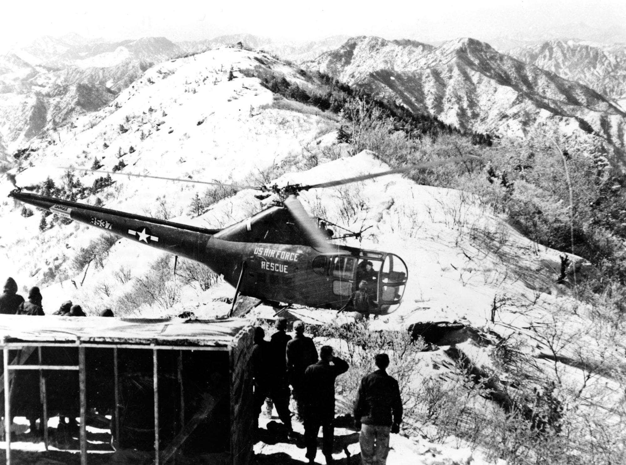 Extreme conditions and rugged terrain challenged Air Rescue Service crews. Here, an H-5G helicopter evacuates an injured Ethiopian UN soldier from a remote, snowy mountaintop radar site in March 1952. (U.S. Air Force photo)