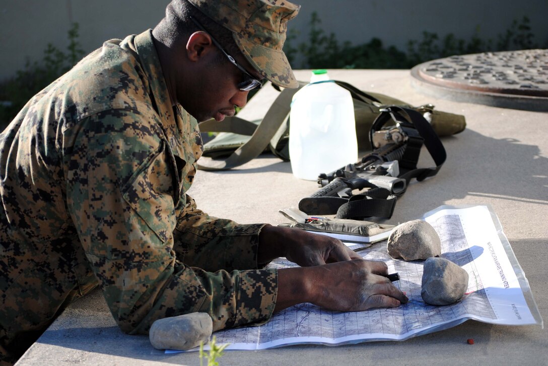 Sgt. Tyrone Sheffield, a mortar section leader with Company L, 3rd Battalion, 23rd Marine Regiment, Montgomery Ala., maps out a plan of attack for his mortar men June 17.::r::::n::::r::::n::Company L is training at the Marine Corps Mountain Warfare Training Center, Calif., as part of exercise Javelin Thrust 2010.