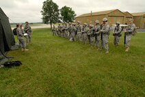Capt. Suzanne VanderWeyst, 115th Public Affairs Officer, briefs members of the 115 Security Forces Squadron, on the proper handling of civilian media during a combat exercise at Volk Field Combat Readiness Training Center, Wis., Jun 14, 2010. The 115th Public Affairs office participated in a combat training exercise that included civilian media personnel as part of refresher training. (U.S. Air Force photo by Tech Sgt. Ashley Bell)