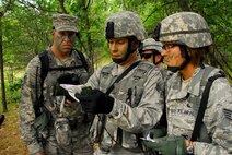 Members from the 115th Security Forces Squadron, verify their route during a land navigation exercise at Volk Combat Readiness Training Center, Wis., June 13, 2010.  The exercise was designed to reinforce skills essential to the Security Forces career field and expose them to scenarios that they may one day face in a real-world situation. (U.S. Air Force photo by Staff Sgt. Stephen Montgomery)