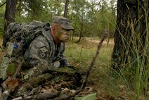 Master Sgt. Kent Falstad, 115th Security Forces Squadron First Sergeant, takes part in a land navigation exercise at Volk Field Combat Readiness Training Center, Wis., June 13, 2010. The 115th SFS participated in a week long combat exercise as part of yearly training for members.  (U.S. Air Force photo by Tech Sgt. Ashley Bell)