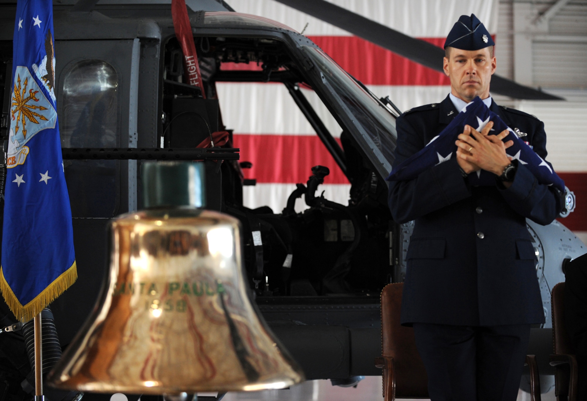 NELLIS AIR FORCE BASE, Nev. -- Lt. Col. Thomas Dorl, 66th Rescue Squadron Commander, pays his respects to his fallen comrades during a memorial ceremony at Nellis Air Force Base, Nev. June 18 to honor 1st Lt. Joel Gentz, 25, a combat rescue officer assigned to the 58th Rescue Squadron; and Staff Sgt. David Smith, 26, a helicopter flight engineer assigned to the 66th Rescue Squadron. The two were among four Airmen killed and three wounded when an HH-60G Pave Hawk helicopter crashed during a medevac mission in southeastern Afghanistan June 9. (U.S. Air Force photo by Master Sgt. Kevin Gruenwald) 


