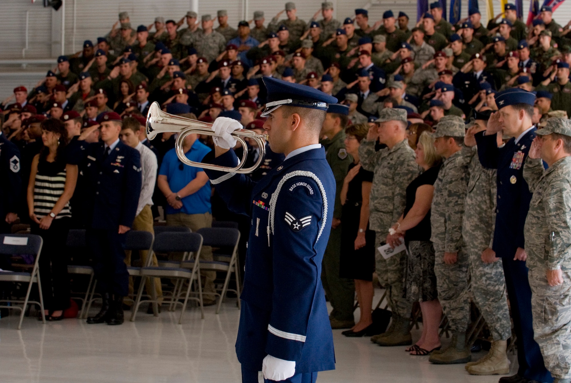 NELLIS AIR FORCE BASE, Nev. -- Senior Airman Anthony Berardocco plays taps during a memorial ceremony for 1st Lt. Joel Gentz, 25, a combat rescue officer assigned to the 58th Rescue Squadron; and Staff Sgt. David Smith, 26, a helicopter flight engineer assigned to the 66th Rescue Squadron at Nellis Air Force Base June 18.  The two were among four Airmen killed and three wounded when an HH-60G Pave Hawk helicopter crashed during a medevac mission in southeastern Afghanistan June 9. (U.S. Air Force Photo / Airman 1st Class Jamie Nicley)