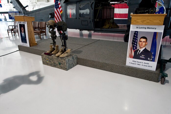 NELLIS AIR FORCE BASE, Nev. -- A pararescue airman renders a salute  1st Lt. Joel Gentz, 25, a combat rescue officer assigned to the 58th Rescue Squadron; and Staff Sgt. David Smith, 26, a helicopter flight engineer assigned to the 66th Rescue Squadron during a memorial ceremony at Nellis Air Force Base June 18.  The two were among four Airmen killed and three wounded when an HH-60G Pave Hawk helicopter crashed during a medevac mission in southeastern Afghanistan June 9.(U.S. Air Force Photo / Lawrence Crespo)