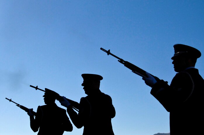 NELLIS AIR FORCE BASE, Nev. -- The Nellis Honor Guard performs a 21 gun salute during a memorial service for 1st Lt. Joel Gentz, 25, a combat rescue officer assigned to the 58th Rescue Squadron; and Staff Sgt. David Smith, 26, a helicopter flight engineer assigned to the 66th Rescue Squadron during a memorial ceremony at Nellis Air Force Base June 18.  The two were among four Airmen killed and three wounded when an HH-60G Pave Hawk helicopter crashed during a medevac mission in southeastern Afghanistan June 9. (U.S. Air Force Photo / Lawrence Crespo)