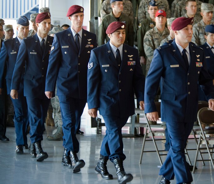 NELLIS AIR FORCE BASE, Nev. -- The official party enters a memorial ceremony for 1st Lt. Joel Gentz, 25, a combat rescue officer assigned to the 58th Rescue Squadron; and Staff Sgt. David Smith, 26, a helicopter flight engineer assigned to the 66th Rescue Squadron at Nellis Air Force Base June 18.  The two were among four Airmen killed and three wounded when an HH-60G Pave Hawk helicopter crashed during a medevac mission in southeastern Afghanistan June 9. (U.S. Air Force Photo / Lawrence Crespo)