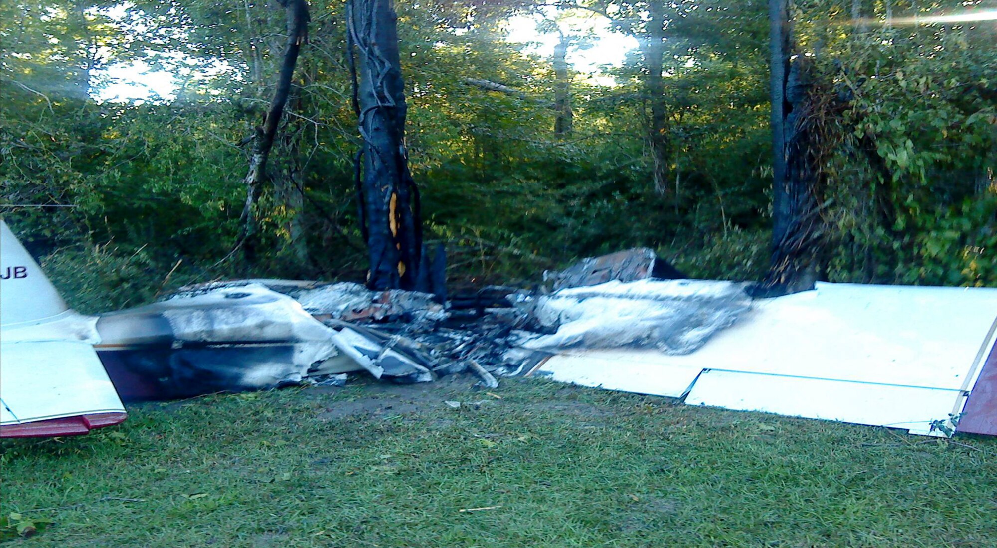(4) When a Brown RV-6 light aircraft crashed on take-off, each wing struck a tree, rupturing the fuel tanks. The spilled fuel immediately caught fire, killing the two pilots who were trapped inside the canopy. (Photos courtesy of the National Transportation Safety Board)