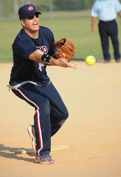 MOODY AIR FORCE BASE, Ga. -- Master Sgt. Robert Adams, 23rd Equipment Maintenance Squadron systems superintendant, pitches a softball during the base softball championship game here June 18. The 23rd EMS munitions flight beat the 23rd Medical Group, with a final score of 19-9. (U.S. Air Force photo by Airman 1st Class Benjamin Wiseman/RELEASED)