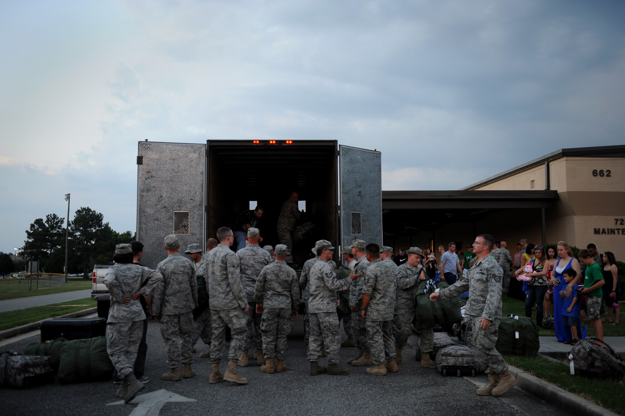 MOODY AIR FORCE BASE, Ga. -- Airmen unload luggage off of a truck here June 16. Deployed Airmen take approximately three to four bags of clothes and equipment with them to perform their mission in a deployed location. (U.S. Air Force photo by Staff Sgt. Gina Chiaverotti-Paige/RELEASED)