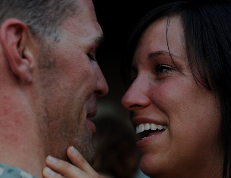 MOODY AIR FORCE BASE, Ga. -- Staff Sgt. William Sparks, 723rd Aircraft Maintenance Squadron aircraft electrical and environmental systems craftsman, kisses his wife Becca here June 17. Sergeant Sparks just returned from Iraq. (U.S. Air Force photo by Staff Sgt. Gina Chiaverotti-Paige/RELEASED)
