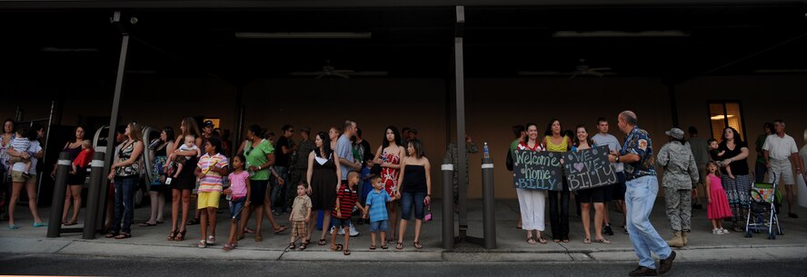 MOODY AIR FORCE BASE, Ga. -- Family and friends wait for the return of their loved ones here June 17. Members from the 723rd Aircraft Maintenance Squadron, 23rd Equipment Maintenance Squadron and 23rd Maintenance Operations Squadron returned from a deployment to Iraq. (U.S. Air Force photo by Staff Sgt. Gina Chiaverotti-Paige/RELEASED)