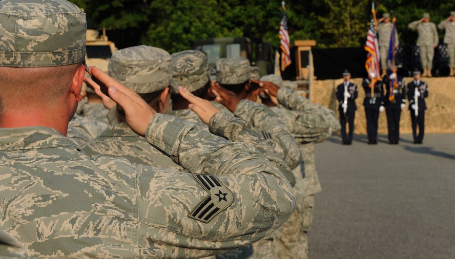 MOODY AIR FORCE BASE, Ga. -- Members of the 820th Security Forces Group salute as Moody’s Honor Guard post the colors during the 820th SFG change of command ceremony here June 18. (U.S. Air Force photo by Airman 1st Class Benjamin Wiseman/RELEASED)