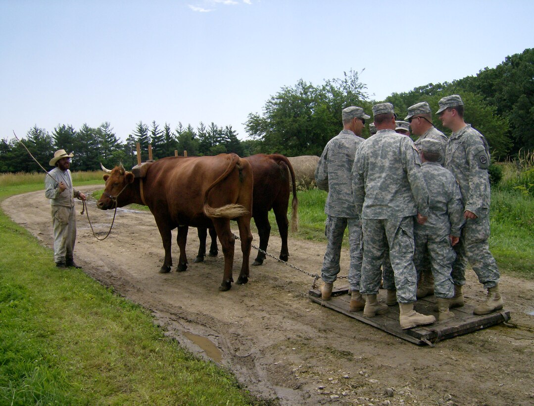 Members of the Iowa National Guard's 734th Agri-Business Development Team get a lesson in the power of draft animals from Living History Farms manager Steve Gray. The Team traveled to Living History Farms in Urbandale, Iowa, to conduct training in unmechanized agriculture ahead of their deployment to Afghanistan later this summer.
