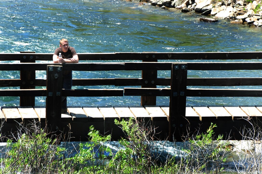 ELLSWORTH AIR FORCE BASE, S.D. -- Airman 1st Class Mitchell Carrell, 28th Civil Engineer Squadron firefighter, takes a break after moderate work in the sun, Rapid Creek Trail Head at Rapid City, S.D., 16 June.  Working too hard in the sun and heat can cause the body to have a heat stroke, which could be fatal. (U.S. Air Force photo/Airman 1st Class Anthony Sanchelli)
