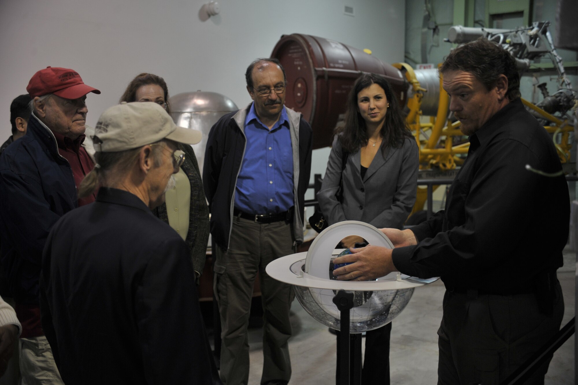 Jay Prichard, Curator, Space and Missile Heritage Center, Vandenberg AFB, uses a model to illustrate the science behind satellite trajectory and the role VAFB has had on the missile testing and training industry. Civic leaders from the Los Angeles, CA area toured the Heritage Center June 16, 2010, during a Space Based Space Surveillance orientation at Vandenberg to gain a better understanding of how programs developed at the Space and Missile Systems Center contribute to the United States space program.  satellite trajectory and space sciene as well as the role VAFB has had on the missile testing and training industry. Civic leaders from the Los Angeles, CA area toured the Heritage Center during a Space Based Space Surveillance orientation at Vandenberg to gain a better understanding of how programs developed at the Space and Missile Systems Center contribute to the United States space program. (Photo by Atiba Copeland)