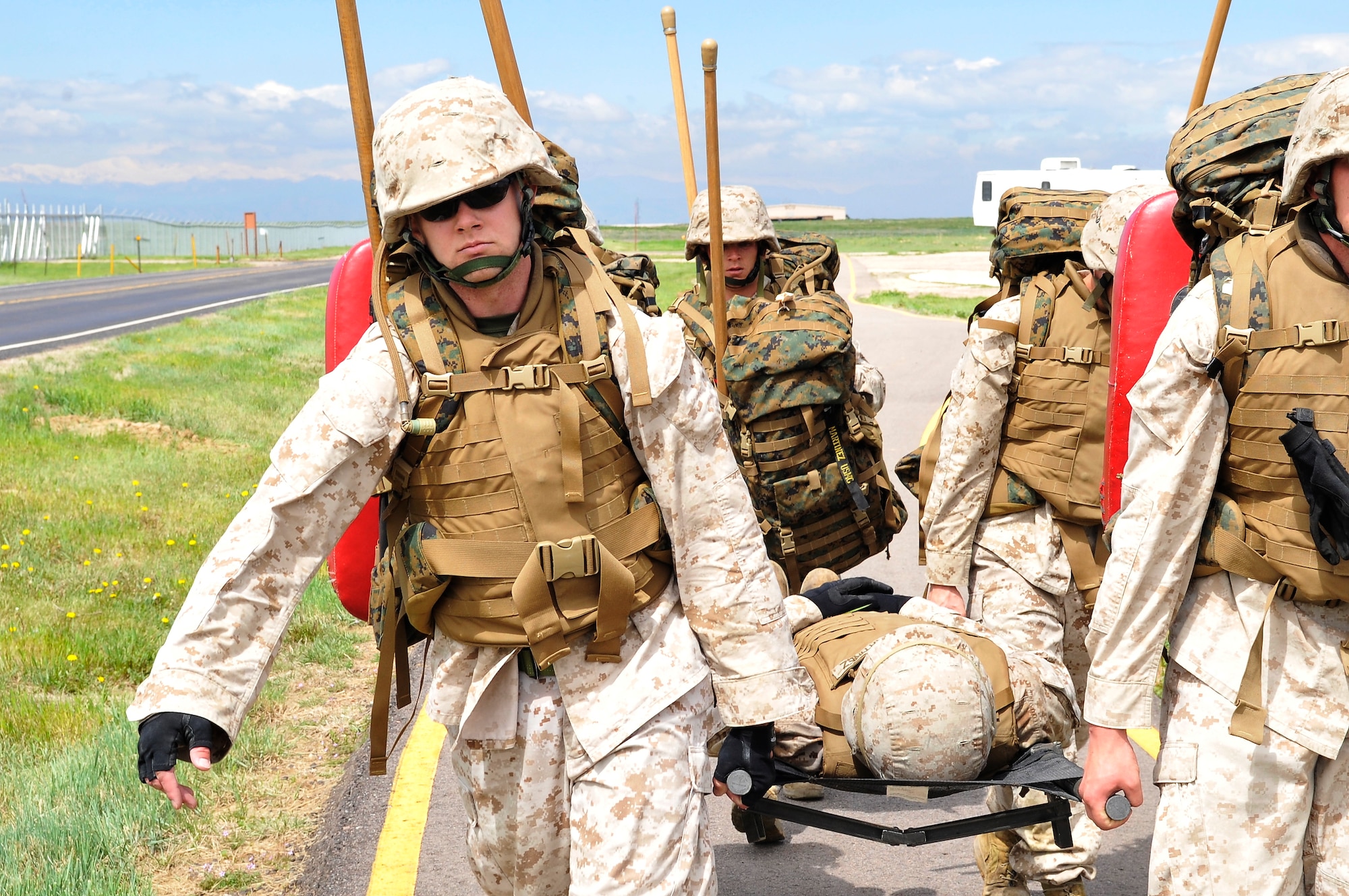 BUCKLEY AIR FORCE BASE, Colo. -- Macs 23 Marines Sgt Randall Blankenship, Cpl Trent Wilcox, Cpl Charles Bays,
Sgt Dale S Steinecke carries SSgt Albert Martinez during a casualty exercise.
The MCMAP class is open to all military members who wish to take part but there most be approval from there commander.
(U.S Air Force photo by Airman 1st Class Paul Labbe) 


