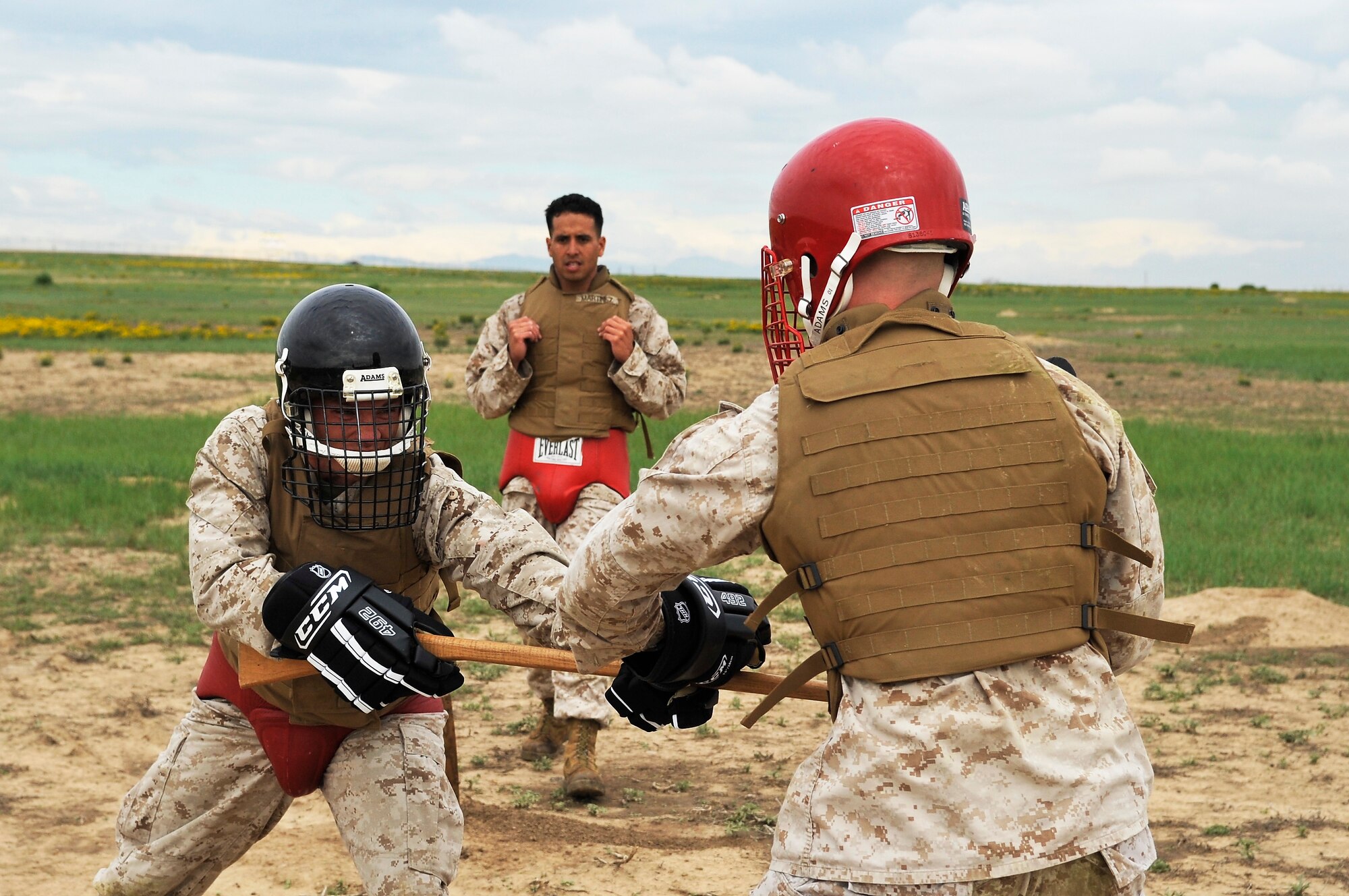 BUCKLEY AIR FORCE BASE, Colo. --SSgt Albert Martinez, Macs 23 observes  Sgt Randall Blankenship, Macs 23 and Cpl Trent Wilcox, Macs 23 engage each other in combat training. Students volunteer themselves to go through the 3 week Marine Corps martial Arts Program course.(U.S Air Force photo by Airman 1st Class Paul Labbe) 
