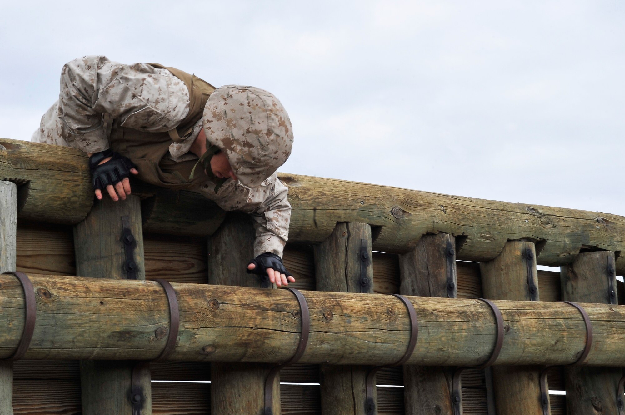 BUCKLEY AIR FORCE BASE, Colo. --
Sgt Randall  Blankenship,Macs-23 climbs over a wall while completing an obstacle course.Students volunteer themselves to go through the 3 week Marine Corps martial Arts Program course.(U.S Air Force photo by Airman 1st Class Paul Labbe) 

