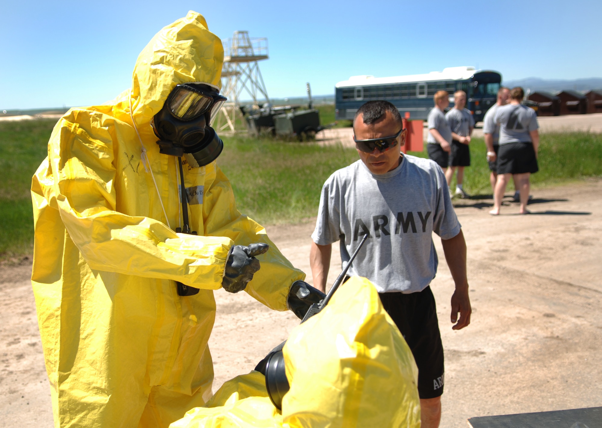ELLSWORTH AIR FORCE BASE, S.D. -- Private Jose Benavides, Army National Guard, 704th Chemical Company chemical biological radiological and nuclear specialist, is briefing soldiers on the decontamination simulation during the 2010 Golden Coyote exercise at Camp Lancer, Ellsworth Air Force Base, S.D., June 18.  The soldiers are manning a station where simulated casualties in-processed into the tent. (U.S. Air Force photo/Airman 1st Class Jarad Denton)