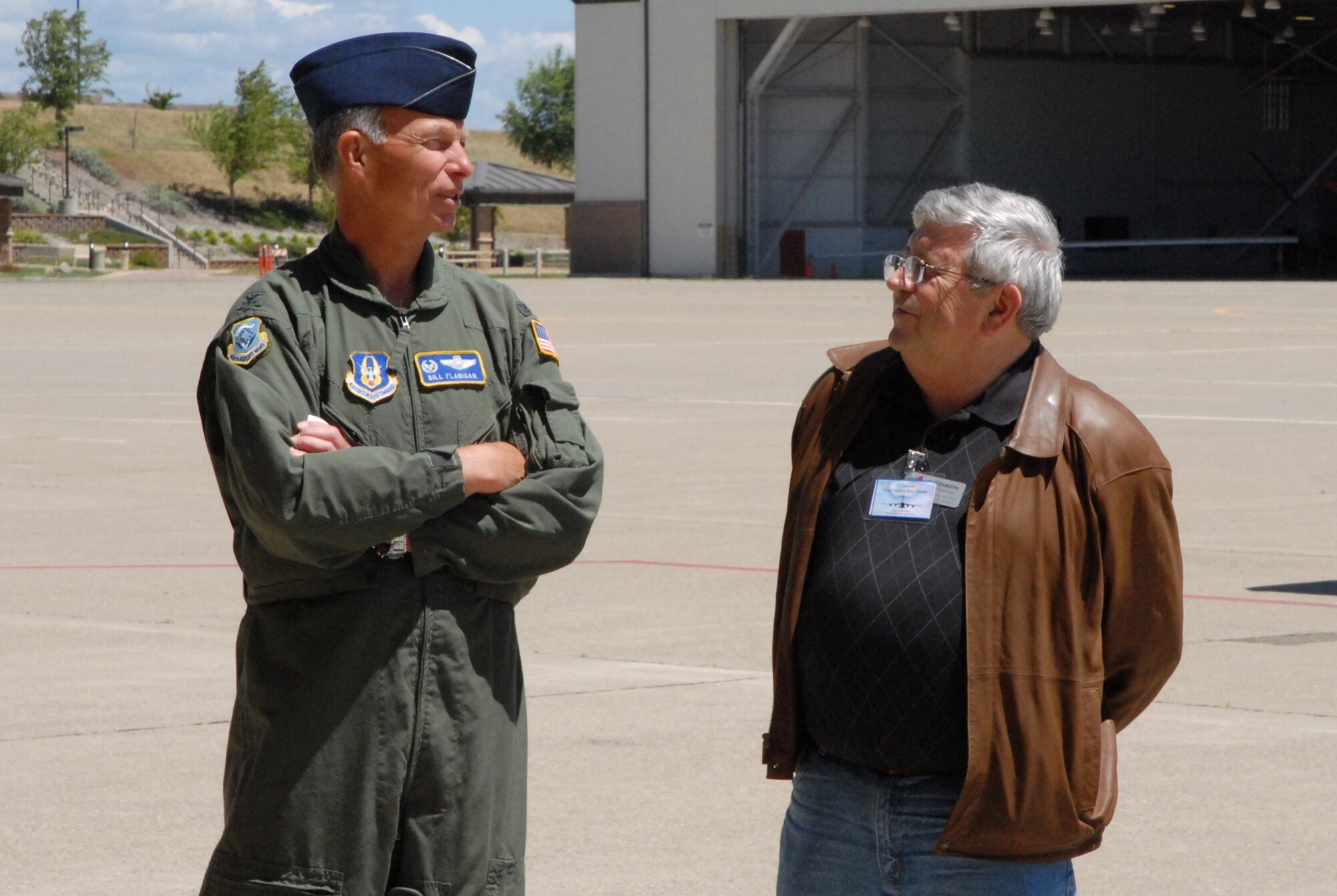 Col. William Flanigan, 446 Wing Commander, talks with a member of the civic leaders group outside of Dock 6.