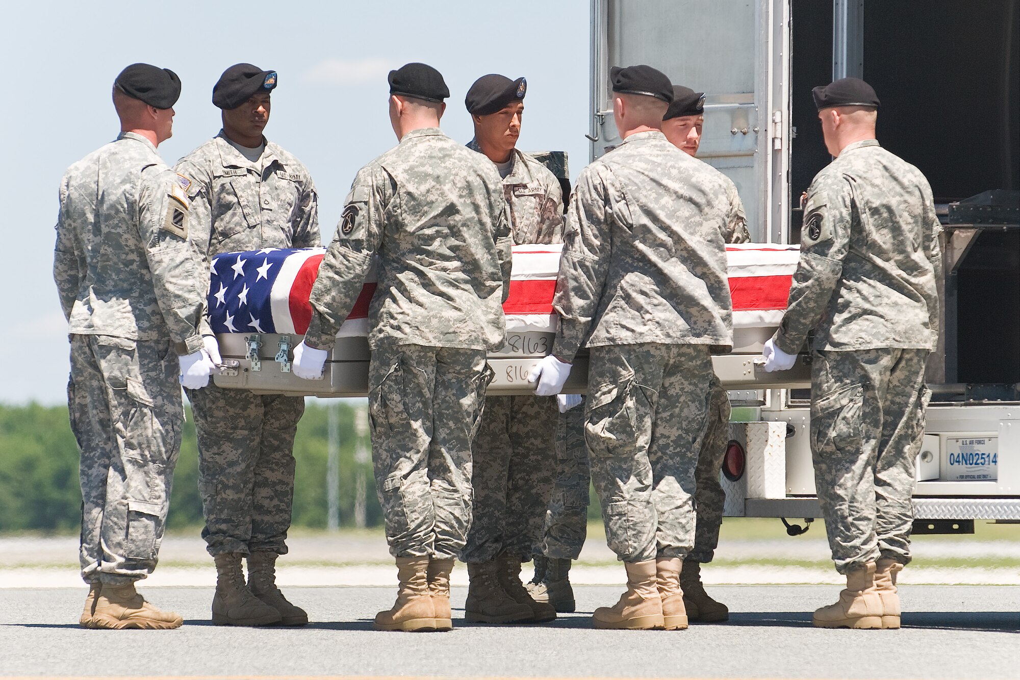 A U.S. Army carry team transfers the remains of Army Spc. Brendan P. Neenan, of Enterprise, Ala., at Dover Air Force Base, Del., June 8. Spc. Neenan was assigned to 2nd Battalion, 508th Parachute Infantry Regiment, 4th Brigade Combat Team, 82nd Airborne Division, Fort Bragg, N.C. (U.S. Air Force photo/Roland Balik)