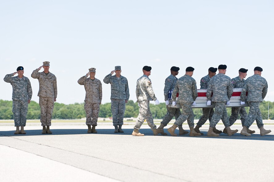 A U.S. Army carry team transfers the remains of Army 2nd Lt. Michael E. McGahan, of Orlando, Fla., at Dover Air Force Base, Del., June 8. 2nd Lt. McGahan was assigned to 1st Brigade Special Troop Battalion, 187th Infantry Regiment, 1st Brigade Combat Team, 101st Airborne Division (Air Assault), Fort Campbell, Ky. (U.S. Air Force photo/Roland Balik)