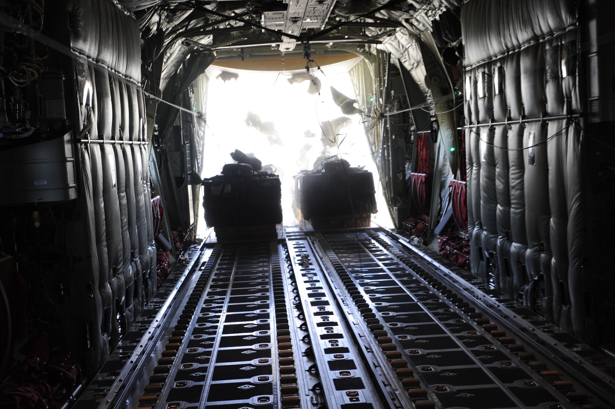 DYESS AIR FORCE BASE, Texas—22 bundles are released from the C-130J Super Hercules June 17 as part of a 22-bundle mass container delivery system airdrop at Bronte Drop Zone over Bronte city to demonstrate the capabilities of the C-130J-model. The regular C-130 Hercules’ are only capable of carrying 16 bundles. The 317th Airlfit Group will be training more on this to help prepare them for deployments. In the course of two years all of the old C-130 Hercules’ will be replaced by the new J-model. (U.S Air Force photo/ Airman 1st Class Shannon Hall)