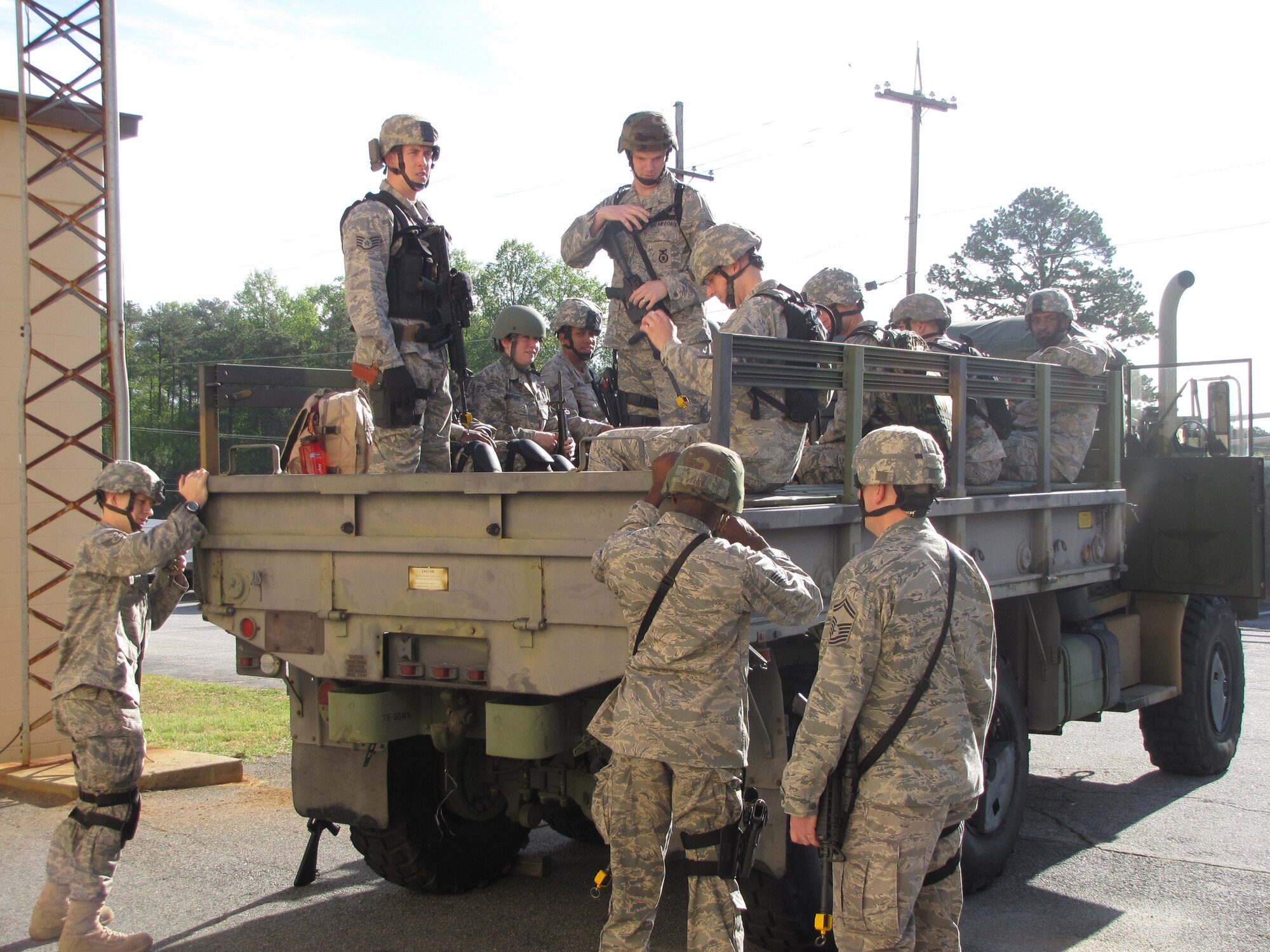 Members prepare convoy for Field Training Exercise site at Dead Runway June 3-6. (U.S. Air Force photo).

