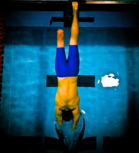 Held at the Olympic Training Center  and the Air Force Academy in Colorado Springs, Colo., the Warrior Games proved to be a great tonic for McGuire. Not only did he fare well in the competitions, but the games helped his rehabilitation process as well. McGuire dives into the pool to compete in the 100-meter freestyle, where he earned the bronze medal. (TSgt Samuel Bendet)
