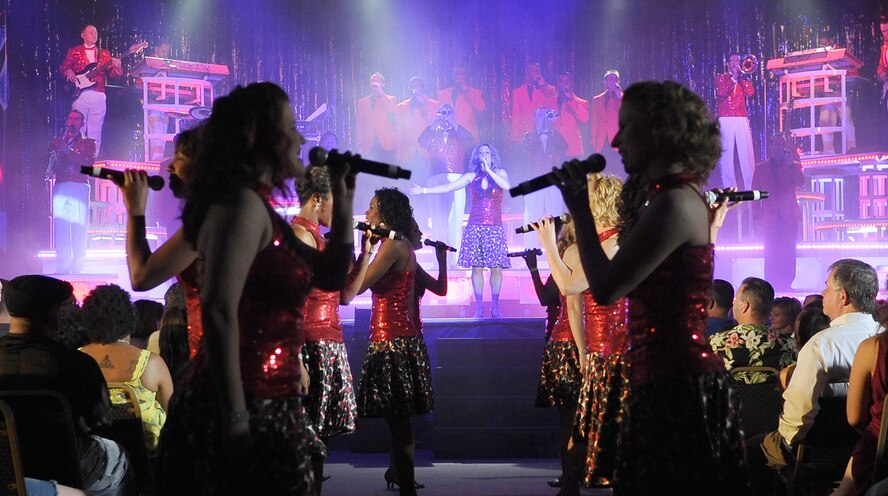 BARKSDALE AIR FORCE BASE, La. -- Air Force Tops in Blue performers begin their show for the Barksdale community here, during the Tops in Blue concert at Hoban Hall June 15. The 2010 tour entitled, "We Believe" featured several rhythm and blues artist covers, swing by Michael Buble, hits by Lady Gaga, Black Eyed Peas and others. Every year, Tops in Blue travels throughout the United States and to more than 25 countries to enhance morale among military personnel and their families. (U.S. Air Force photo/Senior Airman Amber Ashcraft) (RELEASED)