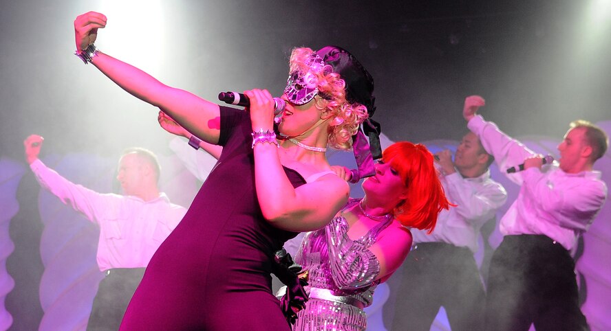 BARKSDALE AIR FORCE BASE, La. -- An Air Force Tops in Blue performer poses as Lady Gaga during a rendition of her song during the Tops in Blue concert at Hoban Hall June 15. The 2010 tour entitled, "We Believe" featured several rhythm and blues artist covers, swing by Michael Buble, hits by Lady Gaga, Black Eyed Peas and others. Every year, Tops in Blue travels throughout the United States and to more than 25 countries to enhance morale among military personnel and their families. (U.S. Air Force photo/Senior Airman Amber Ashcraft) (RELEASED)