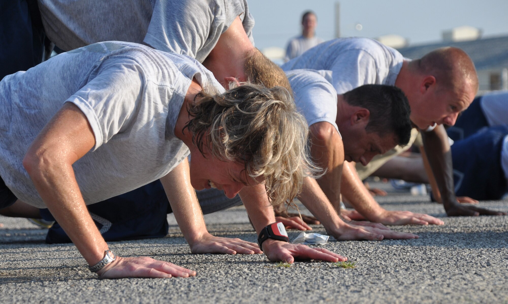 Airmen were tested at Station 3 with modified push-ups during the 96th Air Base Wing Fitness Event June 18. Hosted by the 96th Medical Group, the fitness event touted a medical theme. (U.S. Air Force photo/Staff Sgt. Stacia Zachary)