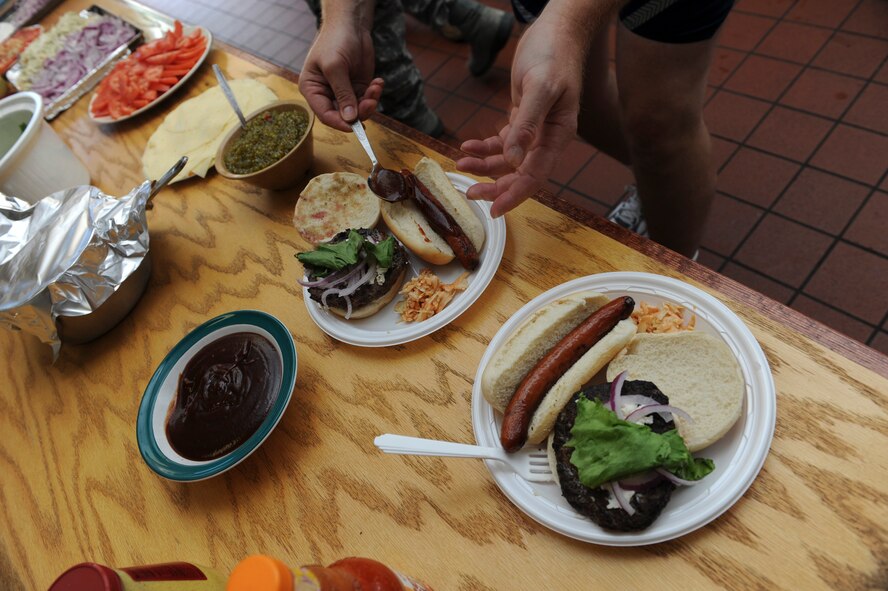 Both squadrons who participated in the Throwdown used their own unique toppings on the burgers and hotdogs. The 106th Mission Support Group at F.S. Gabreski, N.Y, held the first in a series of three cooking Throwdowns on June 18, 2010. The competition between the Force Support Squadron (FSS) and the Logistics Readiness Squadron (LRS) featured hamburgers and hotdogs uniquely topped by squadron. A panel of three judges made up of various Wing members taste tested the food and determined that FSS won best hotdog and LRS won best hamburger. The next Throwdown will be July 31st, 2010, and feature pasta.
(U.S. Air Force Photo / Staff Sgt. David J. Murphy / Released)
